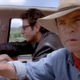 Ellie Sattler and Ian Malcolm messing around in the car while Alan Grant gets an idea.